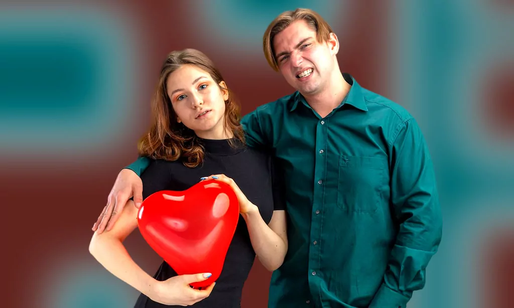 Playful Couple with Red Heart Balloon in Casual Outfits