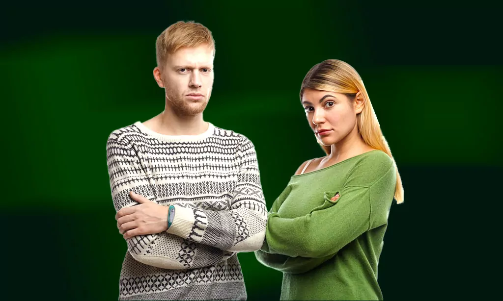 Serious Couple with Arms Crossed in Stylish Sweaters